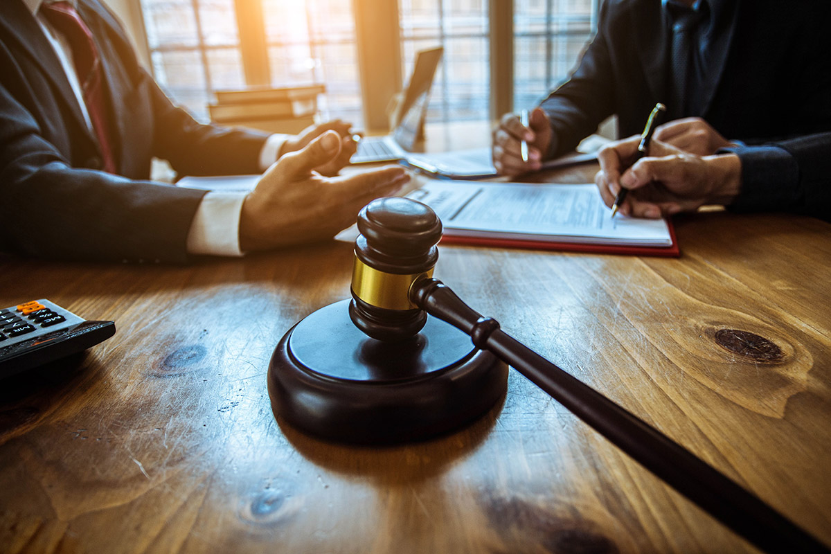 Group of lawyers meeting and a gavel on the table