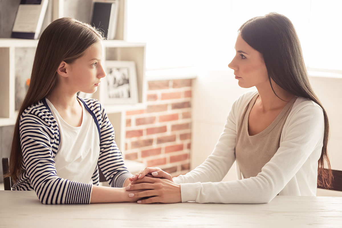 Daughter and mother having a serious conversation